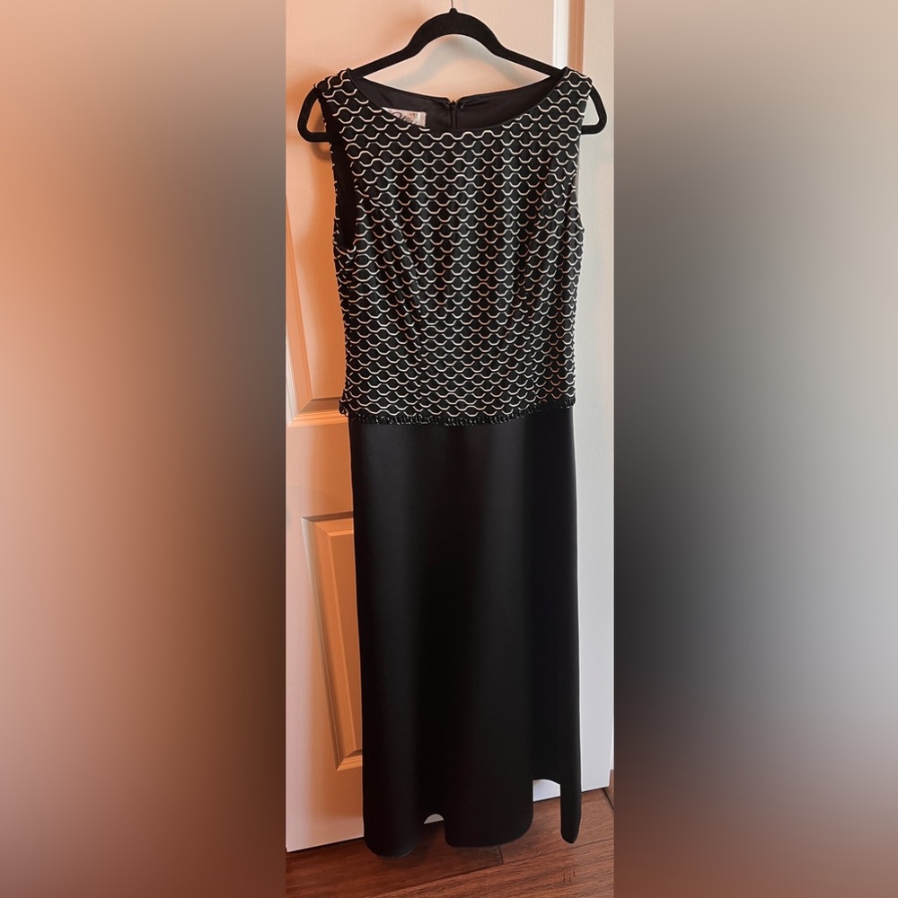 Stunning formal gown. Perfect for a formal summer event. Beaded at waist line.